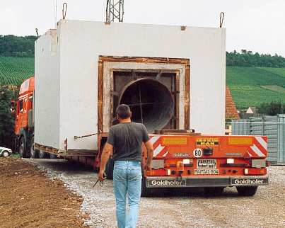 Flat-bed trailer with turbine building